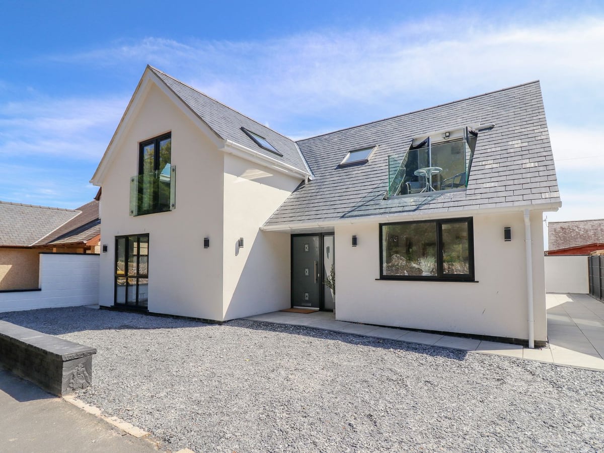 Blackrock Gem modern white house exterior with gravel frontage and glass balcony