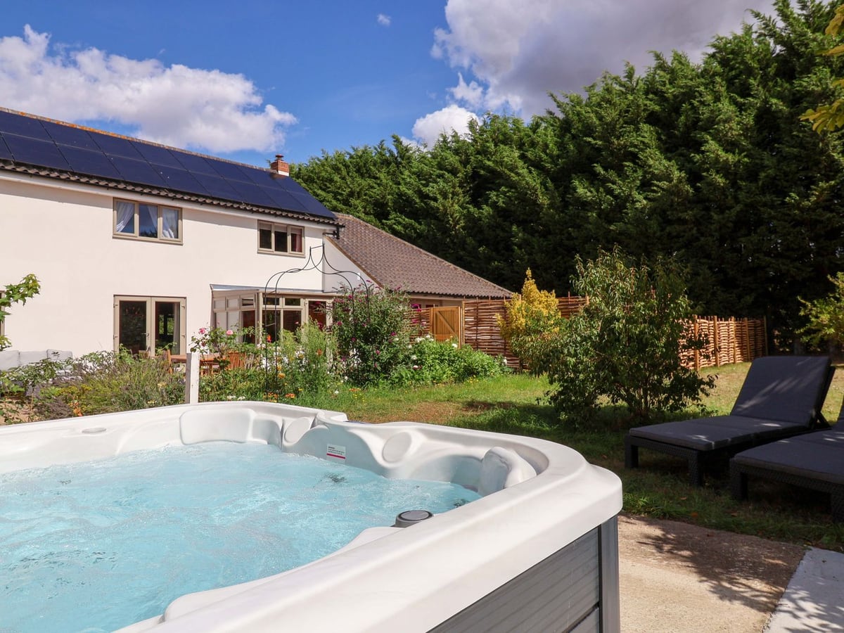 Hot tub in the garden with Holly Farm behind